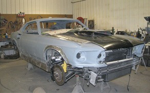 Black and blue Mustang being restored